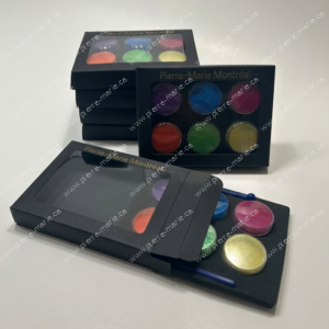 Set of Pierre-Marie Montréal cosmetic pigment pots in a black box with a clear window.